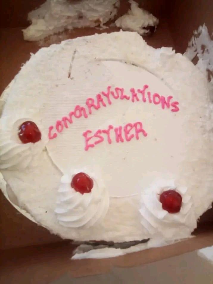 A Congratulations Esther cake topped with cherries