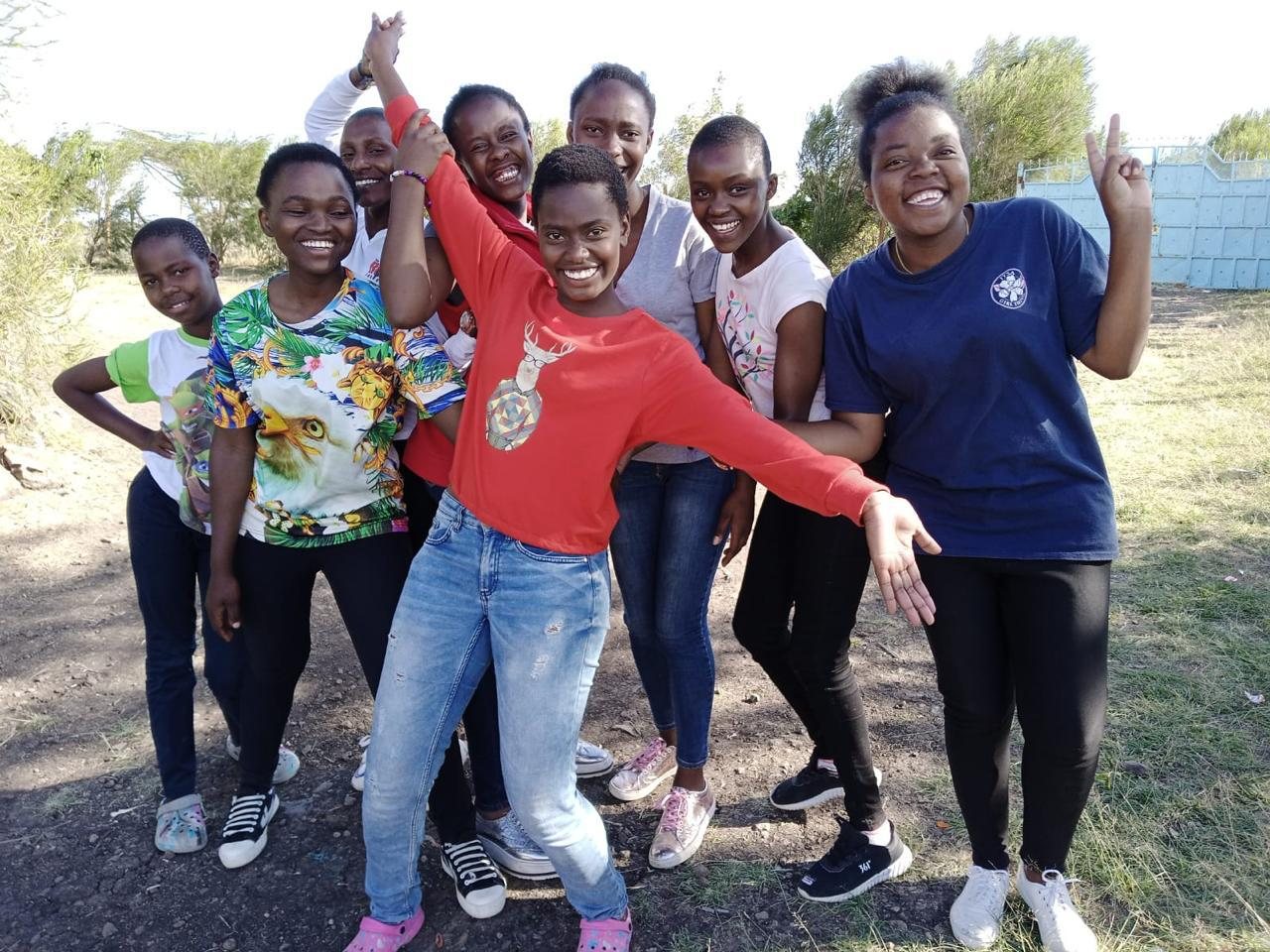 Young women of Sons of Manasseh Children's Home laughing and celebrating together