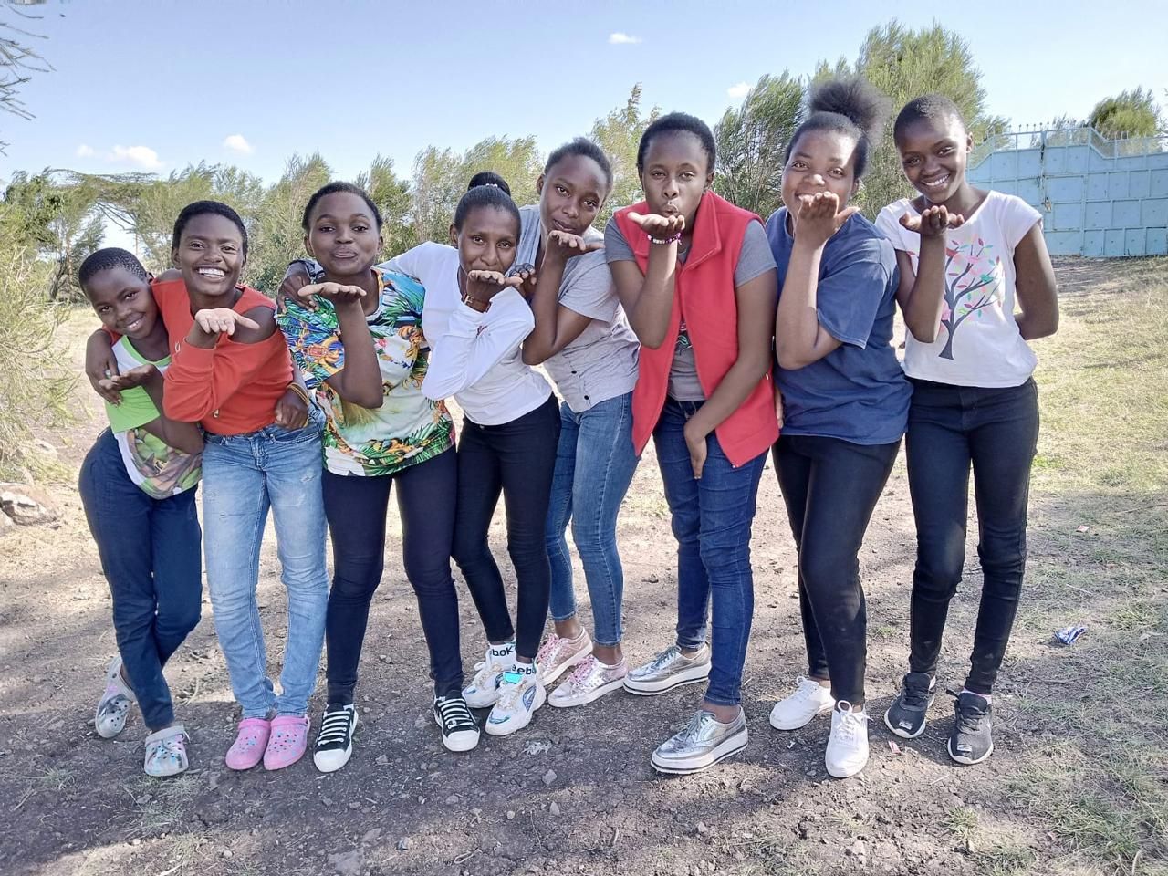 Young women blowing kisses to the camera