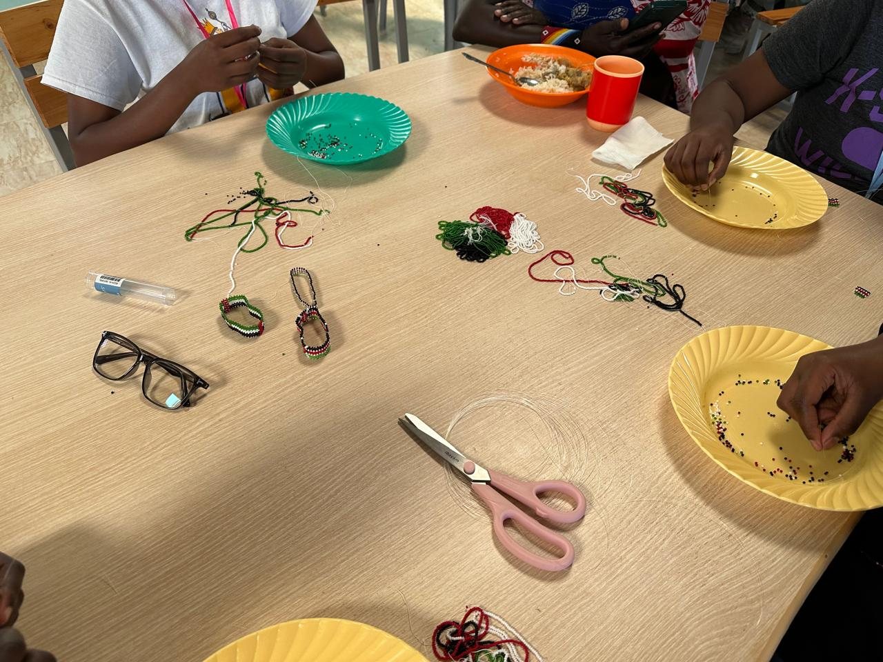 Beadwork in the colours of the Kenyan flag on a table