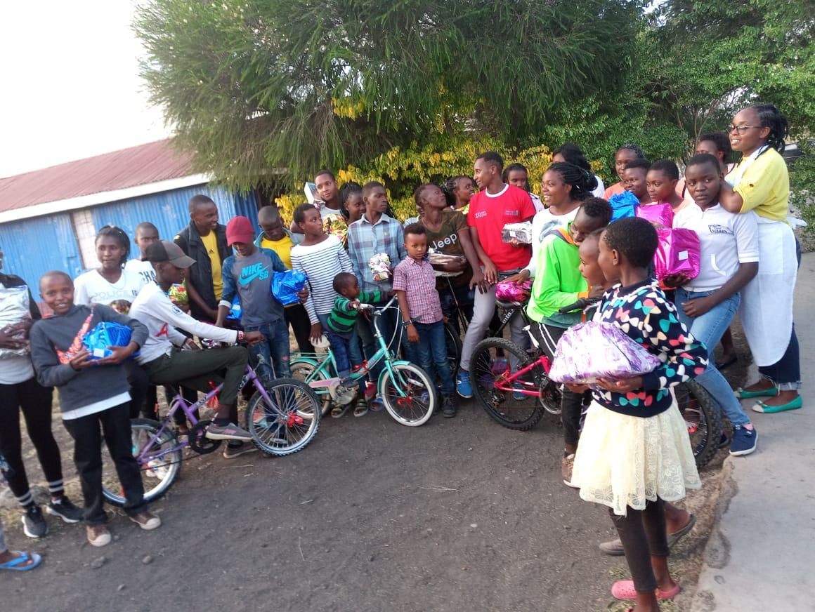 Children and volunteers sharing gifts at Christmas